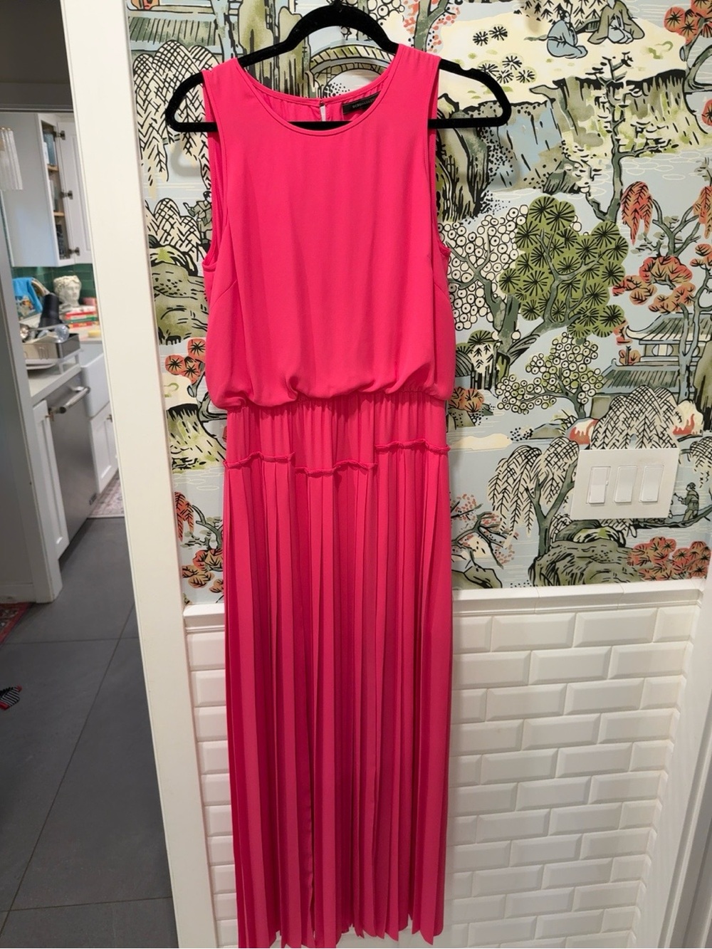 BCBGMAXAZRIA Jenine maxi dress features a pleated skirt and high slits on ea leg